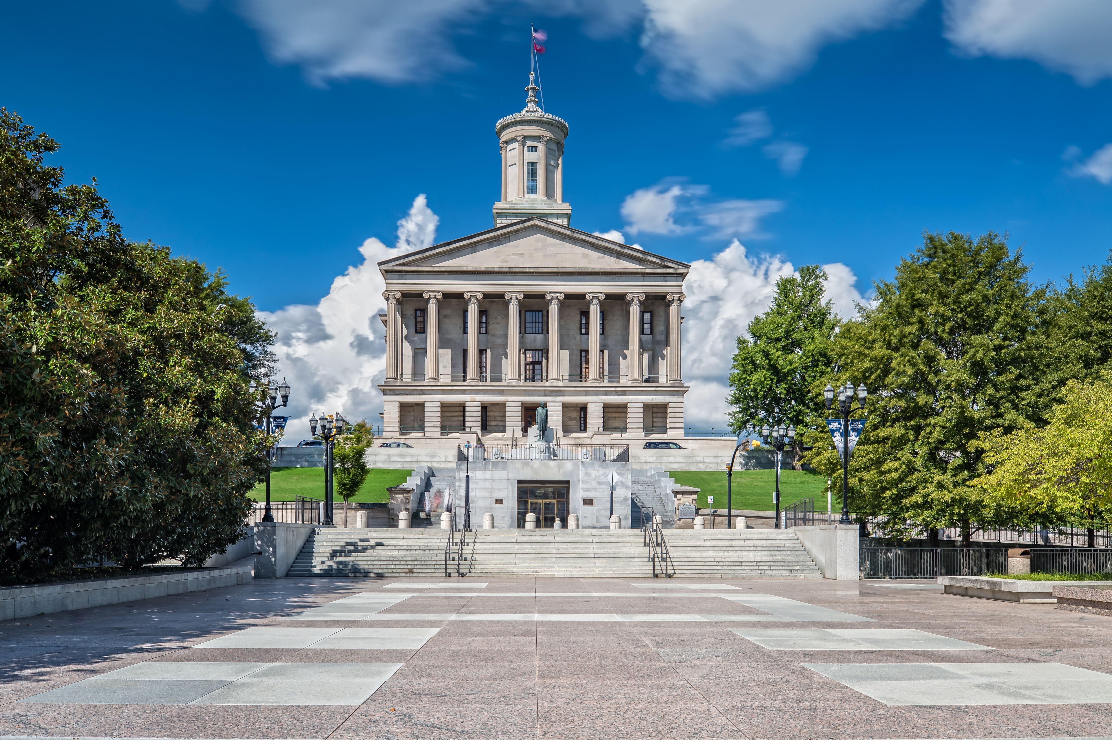 Tennessee State Capitol in Nashville on a bright day with historic architecture and landscaped grounds.