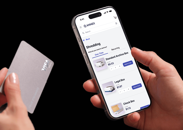 A customer accesses Annex.com’s secure shredding services on a mobile device, selecting document destruction options with a credit card in hand for an easy checkout experience.