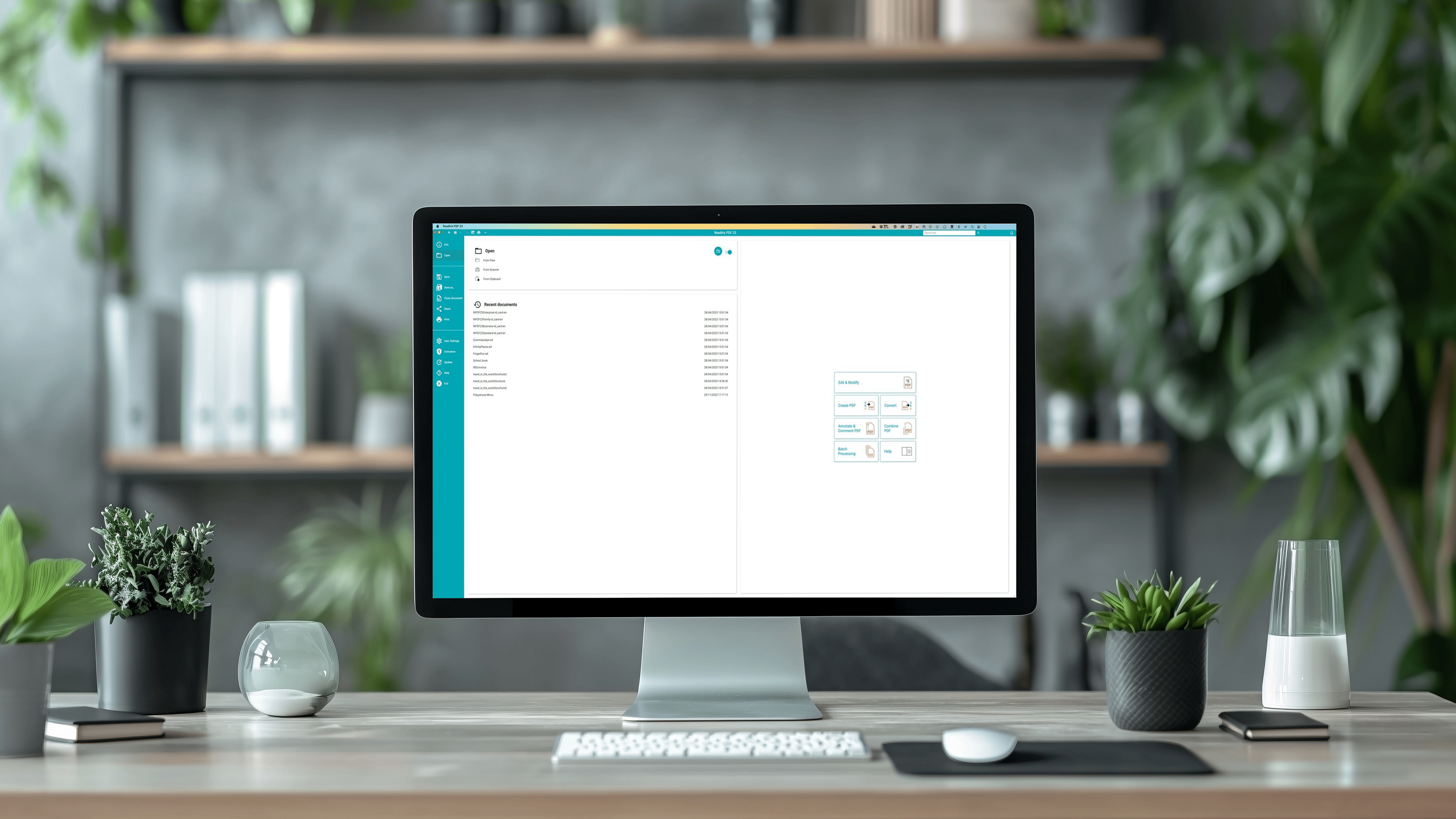 A modern desk setup featuring a large computer monitor displaying a minimalist user interface with recent documents and action buttons. The workspace includes indoor plants, an hourglass, and a sleek, organized aesthetic.