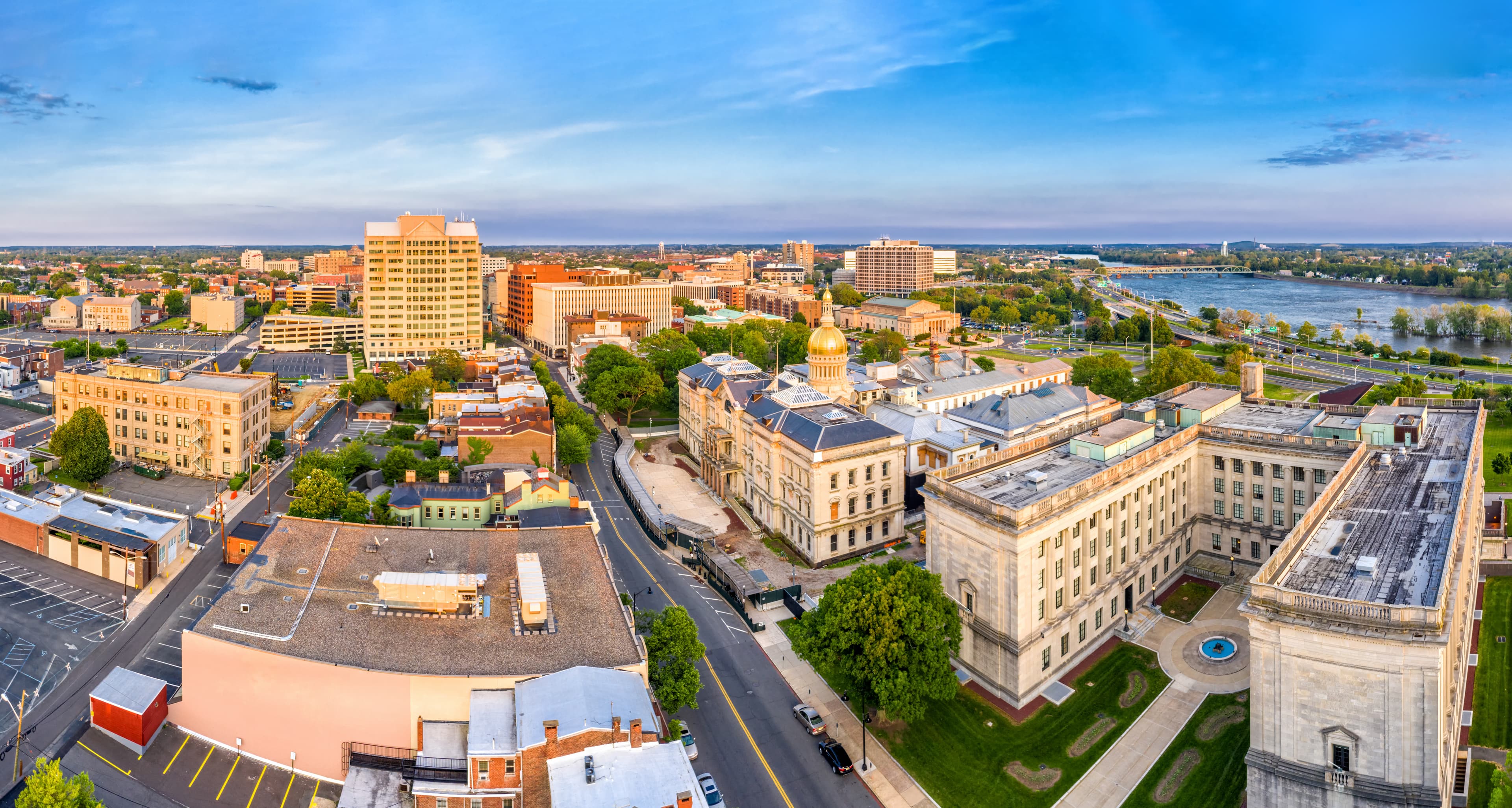 Aerial view of downtown Trenton, New Jersey featuring the New Jersey State House and Delaware River, representing local records management, storage, and shredding service coverage in the Trenton market.