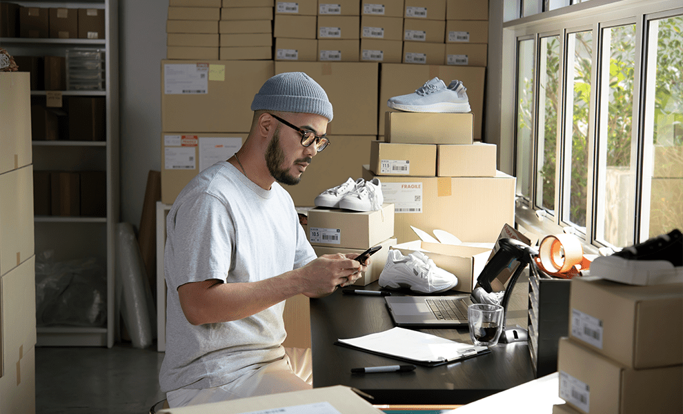 A small business owner managing his records through the Annex platform on his phone. 


